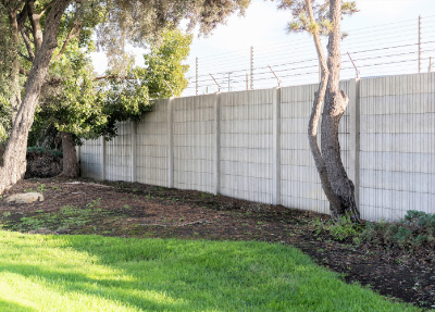 Precast concrete security fence installation